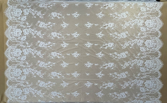 Ivory/Off White Chantilly lace fabric with floral patterns on a brown background - LaceUSA-GDF-11