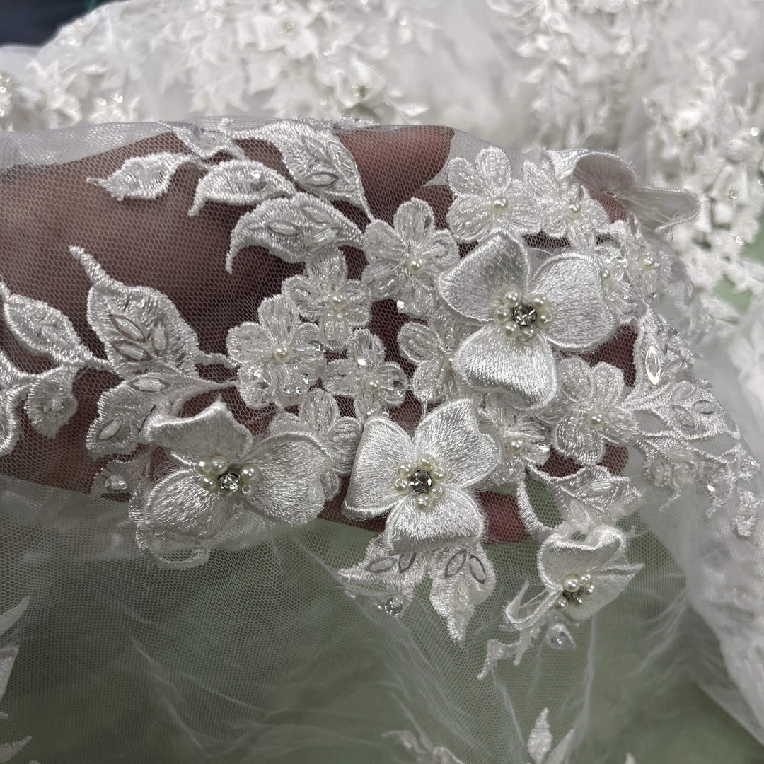 Closeup view of Lace USA GD-3040 3D off white floral lace, embellished with beads and rhinestones—ideal for dresses, gowns, and formalwear.