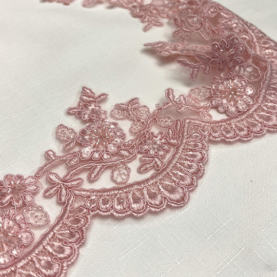 Closeup of Pink beaded corded floral scalloped lace Trim embroidered on polyester net mesh - LaceUSA 96215WHB