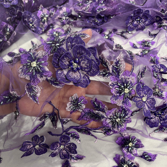 Close-up of Lace USA GD-1613 3D floral lace in purple, embellished with beads and rhinestones—ideal for gowns and formalwear.