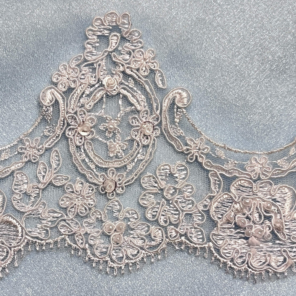 Close up of White floral beaded and corded lace trim with scalloped edge - Lace USA  96926WBP