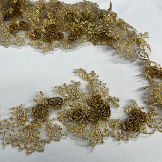 Gold lace trim with 3D rose motifs embroidered with metalic thread on 100% polyester net mesh,, featuring one flat unrolled length and one gathered bundle on a white background. LaceUSA #21853W