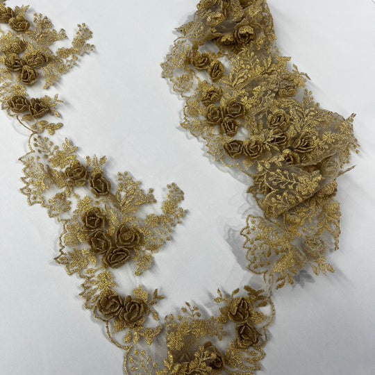 Gold lace trim with 3D rose motifs embroidered with metalic thread on 100% polyester net mesh,, featuring one flat unrolled length and one gathered bundle on a white background. LaceUSA #21853W