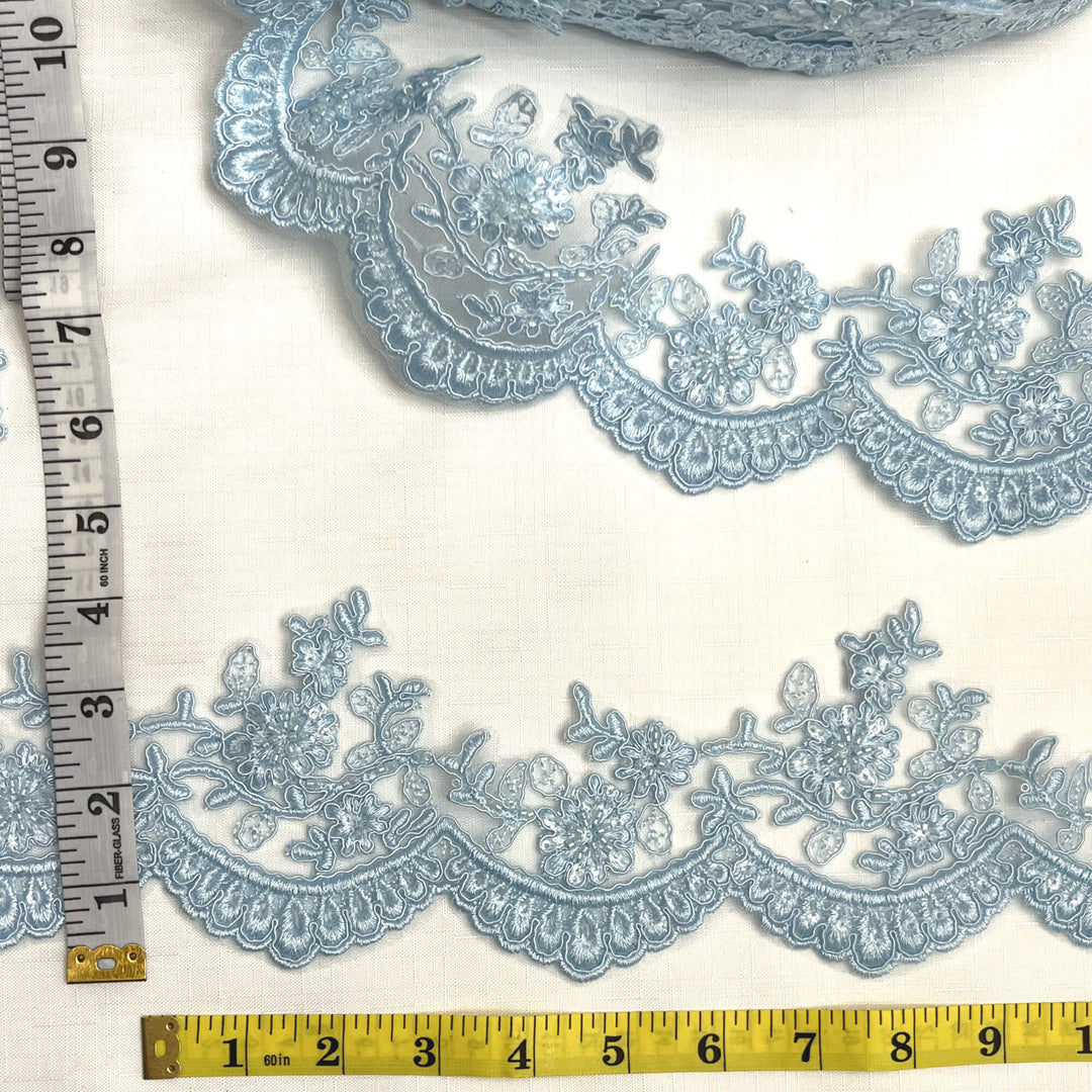 Light blue beaded corded floral scalloped lace embroidered on polyester net mesh with measuring tape for width reference  - LaceUSA 96215WHB