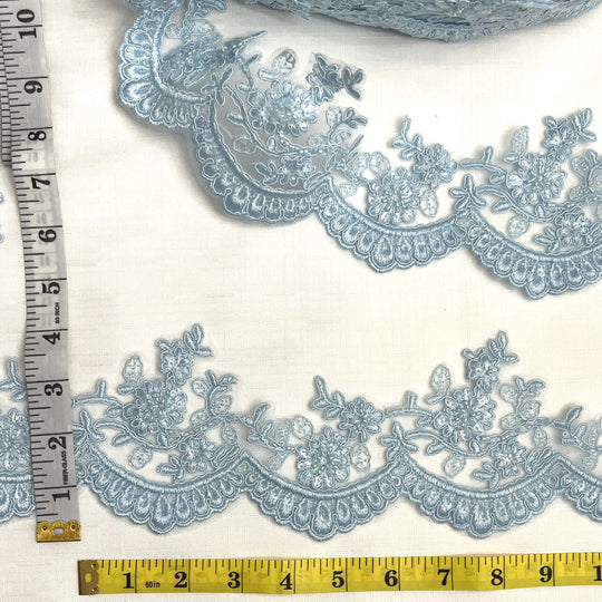 Light blue beaded corded floral scalloped lace embroidered on polyester net mesh with measuring tape for width reference  - LaceUSA 96215WHB