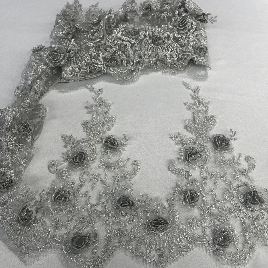 Silver floral lace trim with embroidered 3D roses on net mesh backing, laid out on a white background. LaceUSA #21856W