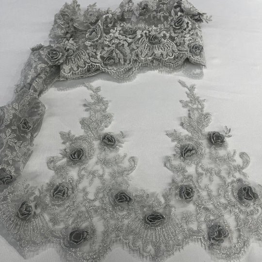 Silver floral lace trim with embroidered 3D roses on net mesh backing, laid out on a white background. LaceUSA #21856W