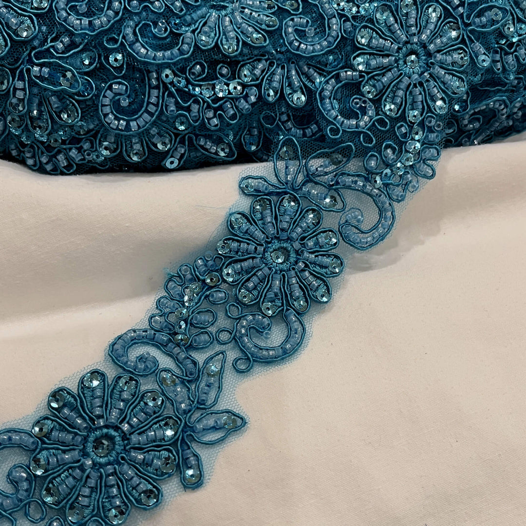 Closeup of Teal Floral Beaded and Corded Lace Trim Embroidered on net mesh | Lace USA #96275WHB Teal