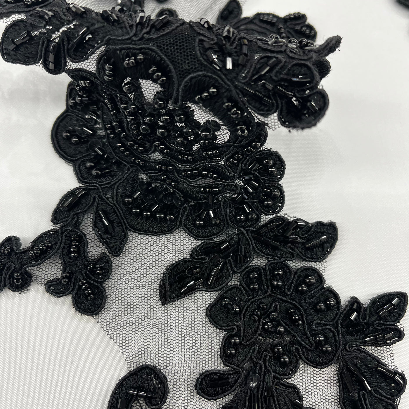 Beaded & Corded Floral Appliqué Lace Embroidered on 100% Polyester Organza or Net Mesh. This can be applied to Theatrical dance ballroom costumes, bridal dresses, bridal headbands endless possibilities. Sold By Pair Lace Usa