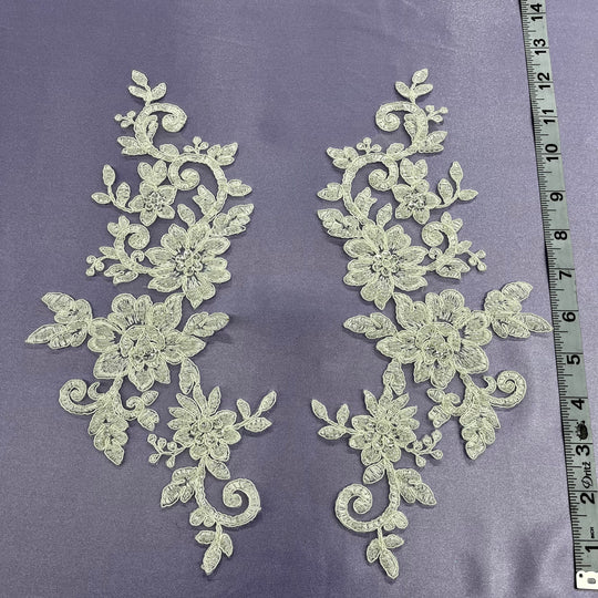 Beaded & Corded Silver Floral Appliqué Lace Embroidered on 100% Polyester Organza or Net Mesh. This can be applied to Theatrical dance ballroom costumes, bridal dresses, bridal headbands endless possibilities. Sold By Pair. Lace Usa