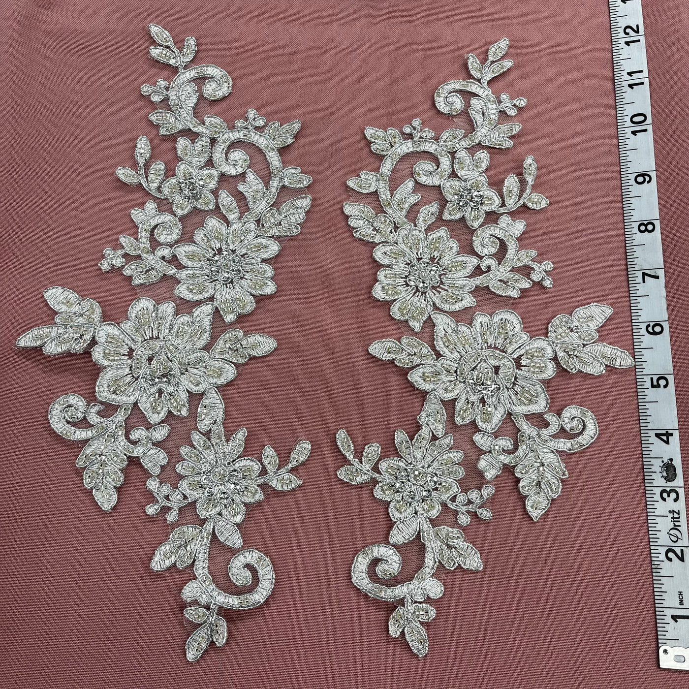 Beaded & Corded Silver Floral Appliqué Lace Embroidered on 100% Polyester Organza or Net Mesh. This can be applied to Theatrical dance ballroom costumes, bridal dresses, bridal headbands endless possibilities. Sold By Pair. Lace Usa