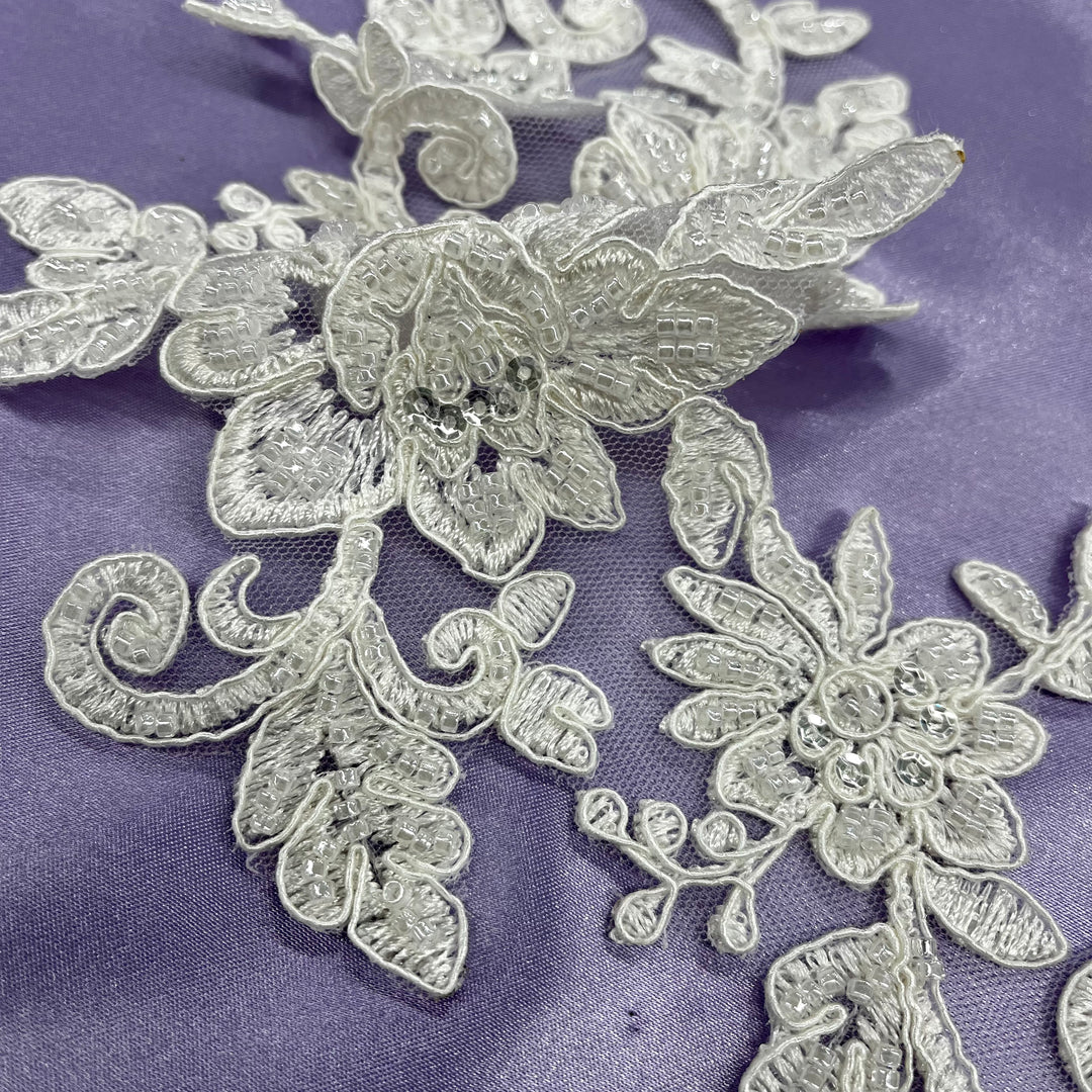 Beaded & Corded Silver Floral Appliqué Lace Embroidered on 100% Polyester Organza or Net Mesh. This can be applied to Theatrical dance ballroom costumes, bridal dresses, bridal headbands endless possibilities. Sold By Pair. Lace Usa