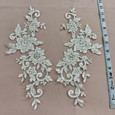 Beaded & Corded Silver Floral Appliqué Lace Embroidered on 100% Polyester Organza or Net Mesh. This can be applied to Theatrical dance ballroom costumes, bridal dresses, bridal headbands endless possibilities. Sold By Pair. Lace Usa