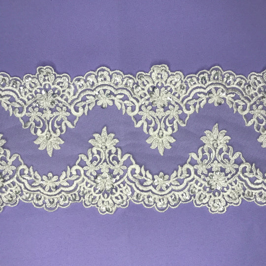 Double Sided Beaded White Trimming, Embroidered on 100 % Polyester Net Mesh.  Sold by the Yard.  Lace Usa