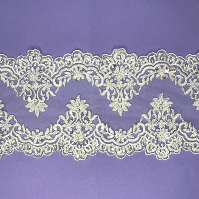 Double Sided Beaded White Trimming, Embroidered on 100 % Polyester Net Mesh.  Sold by the Yard.  Lace Usa