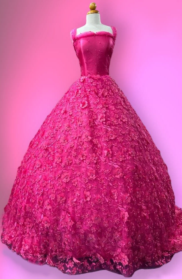 A mannequin displaying the Fuchsia beaded 3D floral lace fabric embroidered on polyester net mesh.