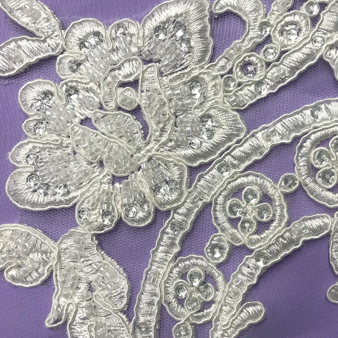 Beaded & Corded Floral Appliqué Lace Embroidered on 100% Polyester Organza or Net Mesh. This can be applied to Theatrical dance ballroom costumes, bridal dresses, bridal headbands endless possibilities.  Sold By Pair  Lace Usa