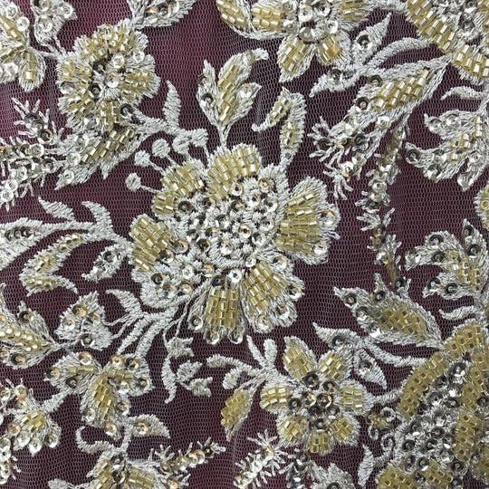 Embroidered & Heavily Beaded Fabric on net.  Sold by the yard.  Lace Usa