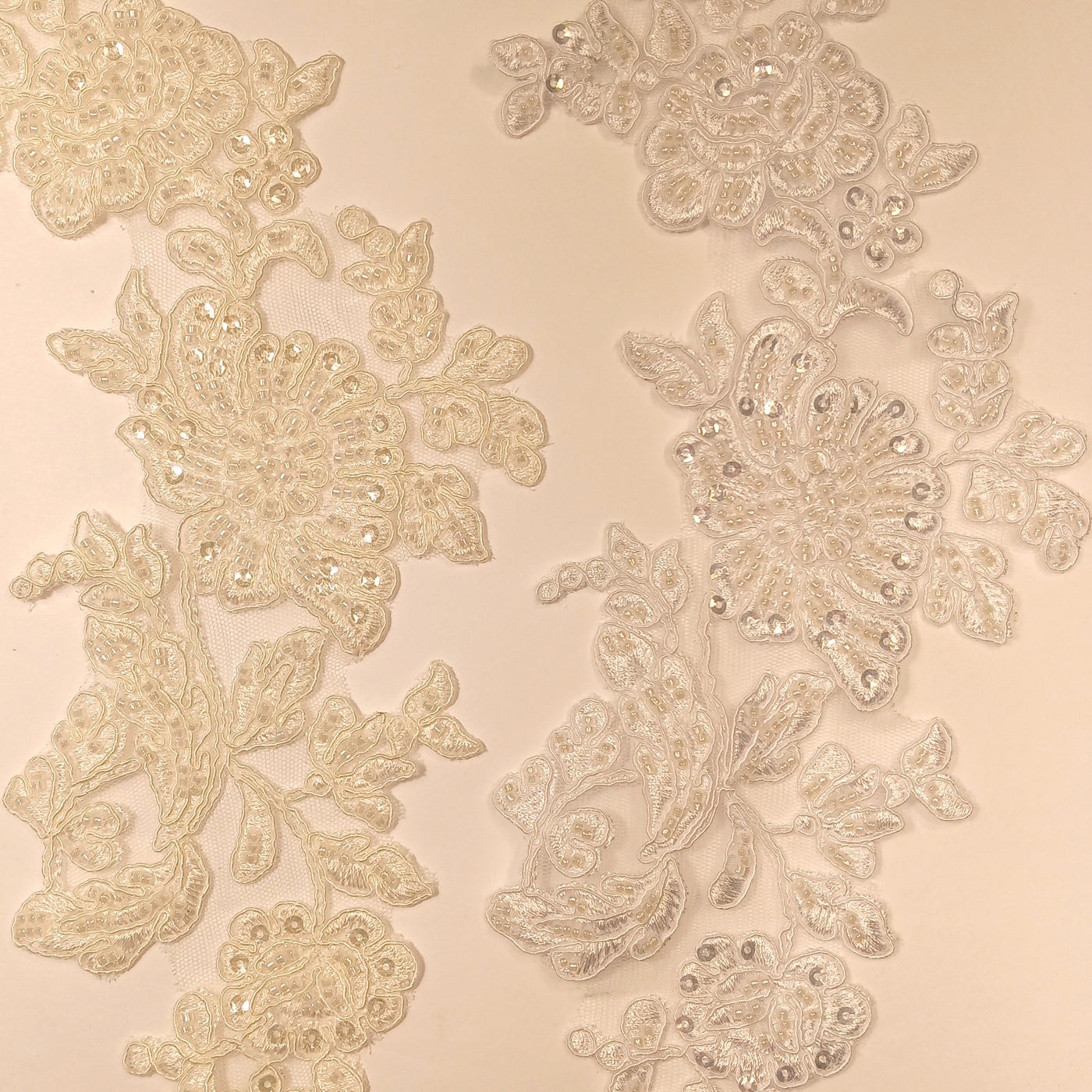 Beaded & Corded Floral Appliqué Lace Embroidered on 100% Polyester Organza or Net Mesh. This can be applied to Theatrical dance ballroom costumes, bridal dresses, bridal headbands endless possibilities.  Sold By Pair.  Lace Usa