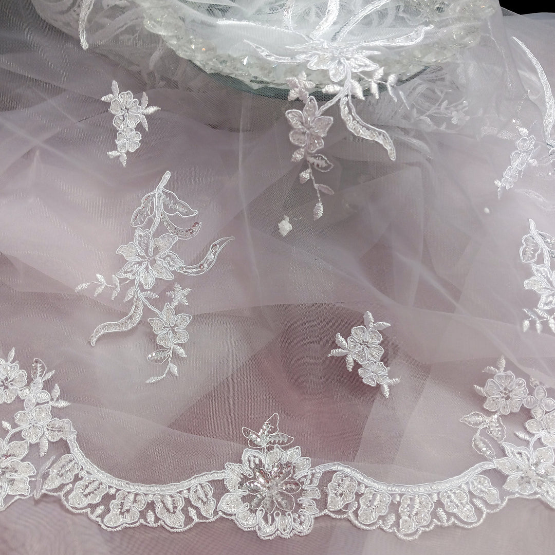 Corded & Beaded Bridal Lace Fabric Embroidered on 100% Polyester Net Mesh.  Sold the yard.  Lace Usa