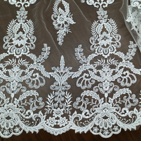 Corded & Beaded Bridal Lace Fabric Embroidered on 100% Polyester Net Mesh.  Sold the yard.  Lace Usa