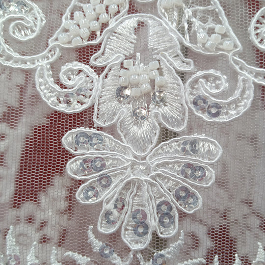 Corded & Beaded Bridal Lace Fabric Embroidered on 100% Polyester Net Mesh.  Sold the yard.  Lace Usa