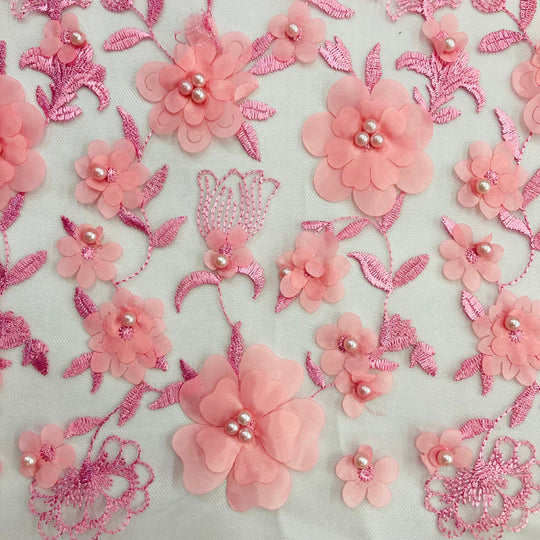 Closeup of light Pink 3D Floral Embroidered & Beaded Net Fabric with Beads. Lace USA