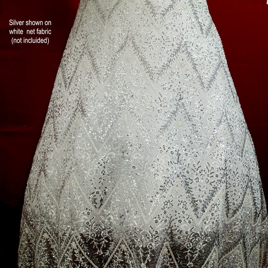 Embroidered & Heavily Beaded with Beads & sequin on Net Mesh Fabric.  Sold by the yard.  Lace Usa