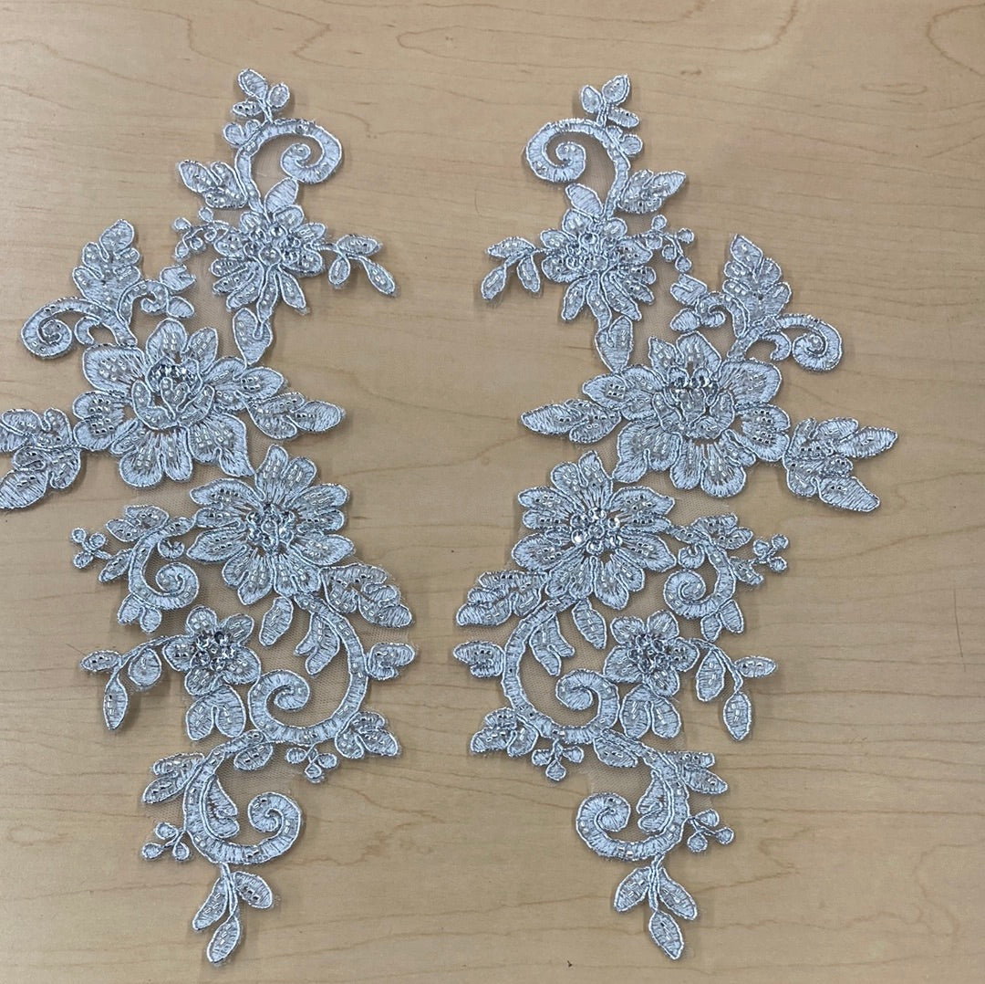 Beaded & Corded Silver Floral Appliqué Lace Embroidered on 100% Polyester Organza or Net Mesh. This can be applied to Theatrical dance ballroom costumes, bridal dresses, bridal headbands endless possibilities.  Sold By Pair.  Lace Usa